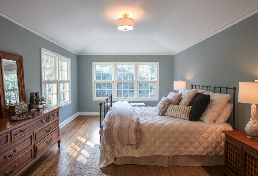 Sky-blue-walled, hardwood-floored, natural-light-filled Twin Cities bedroom renovation.