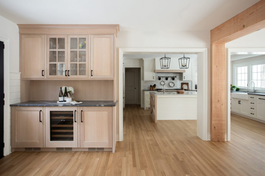 Architectural remodeling integrates spacious kitchen, natural wood built-in, Twin Cities.