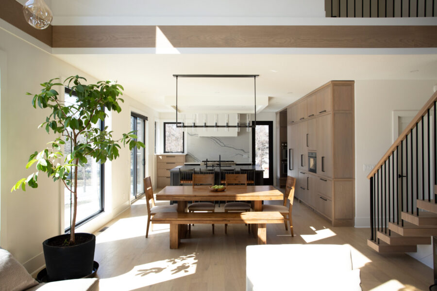 Sunlight fills this Twin Cities kitchen remodel. Light wood, white walls, and an island define the open-concept design.