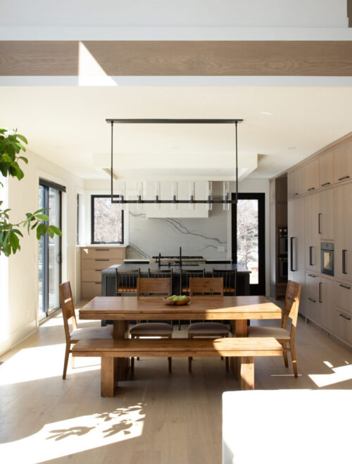 Contemporary kitchen remodeling showcasing integrated dining island within Minneapolis residence