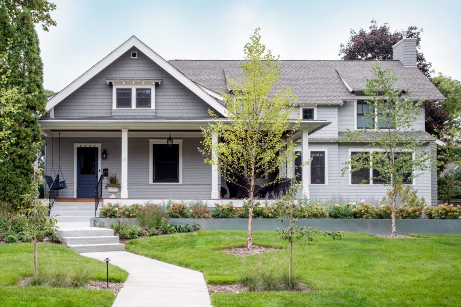 Updated architectural gray shingle exterior defines Twin Cities home renovation.