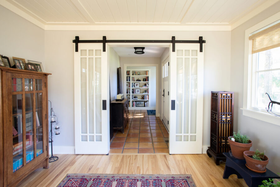Newly renovated Twin Cities home boasts frosted barn doors, natural wood floors.