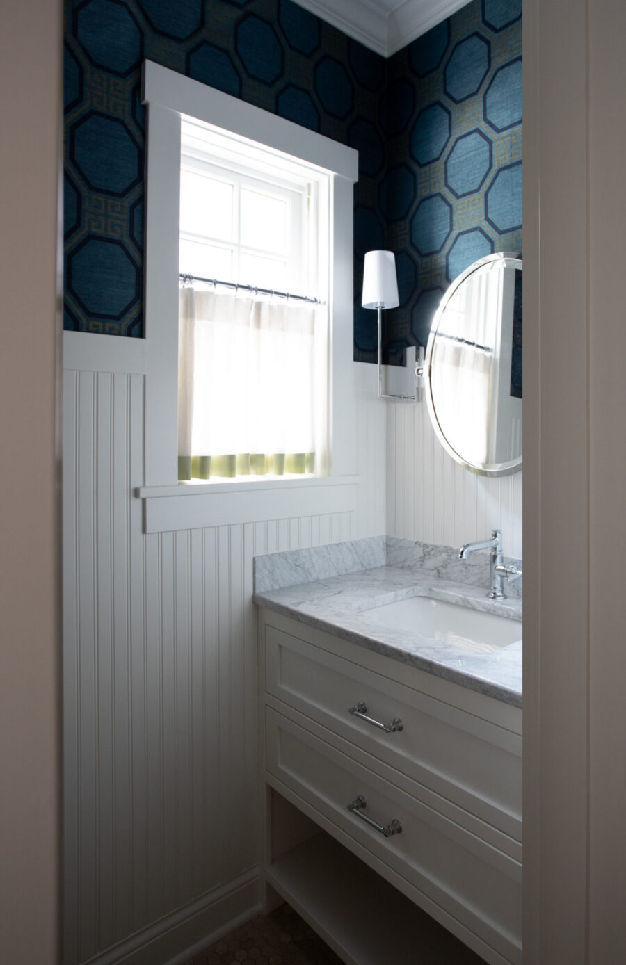 Twin Cities design build crafts beadboard, marble vanity, patterned walls.