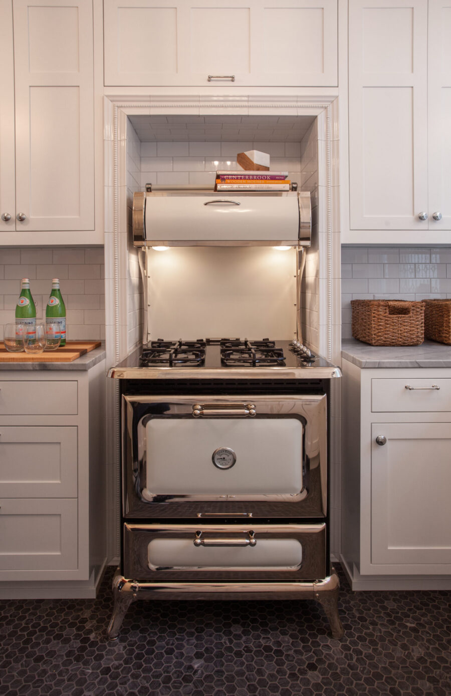 Twin Cities kitchen remodel features white cabinets, subway tile, vintage chrome range.