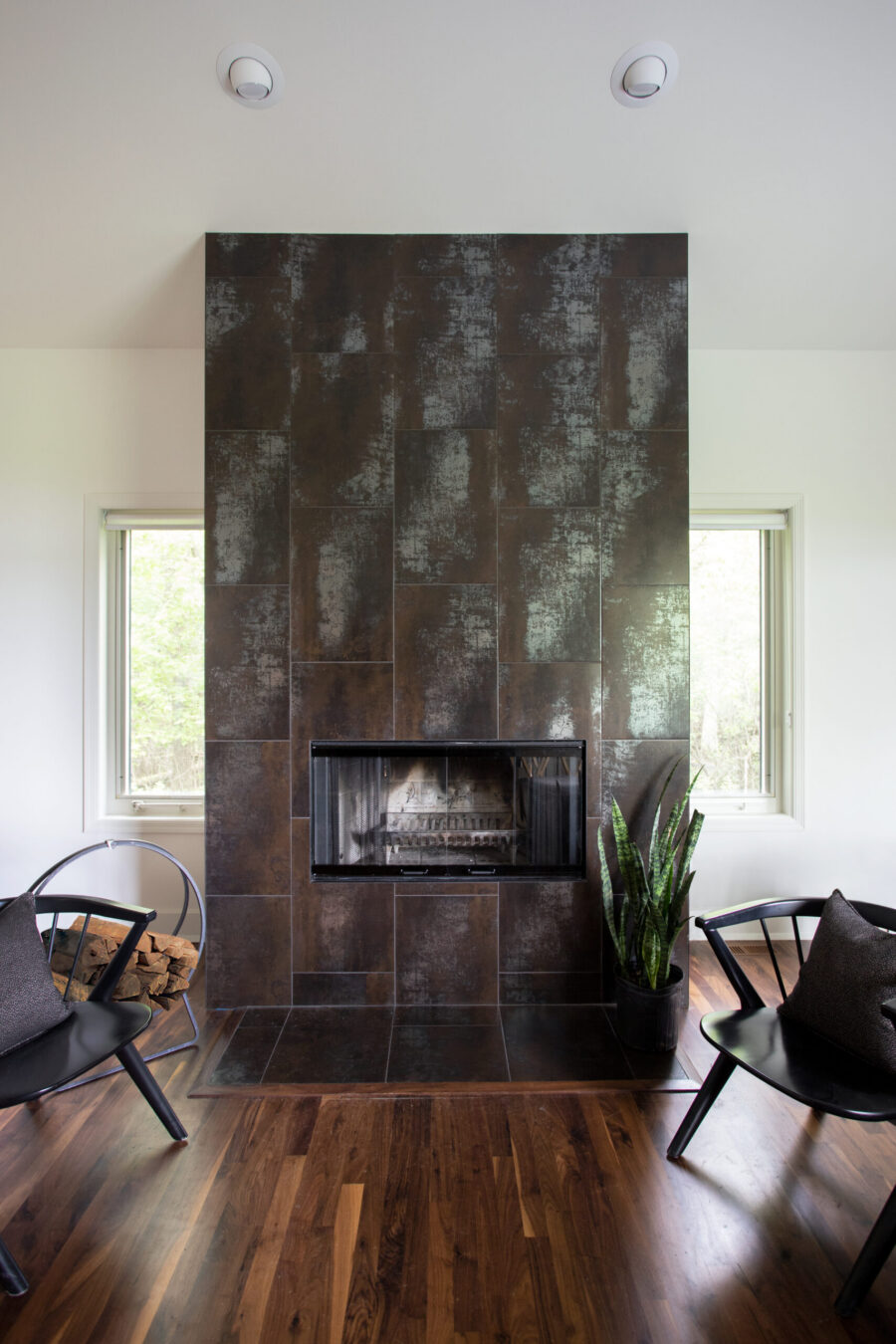 Twin Cities living room remodel boasts a substantial dark-tiled fireplace.