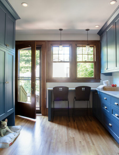 Twin Cities kitchen design-build: blue cabinetry, wood floors, white countertops, tile.