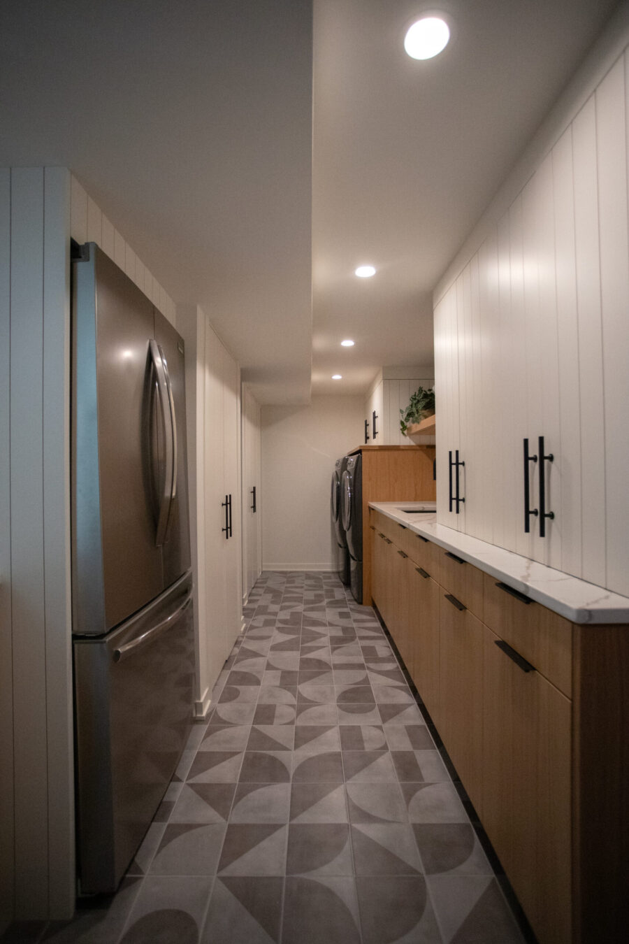 Contemporary Twin Cities laundry and utility renovation features bespoke cabinetry.