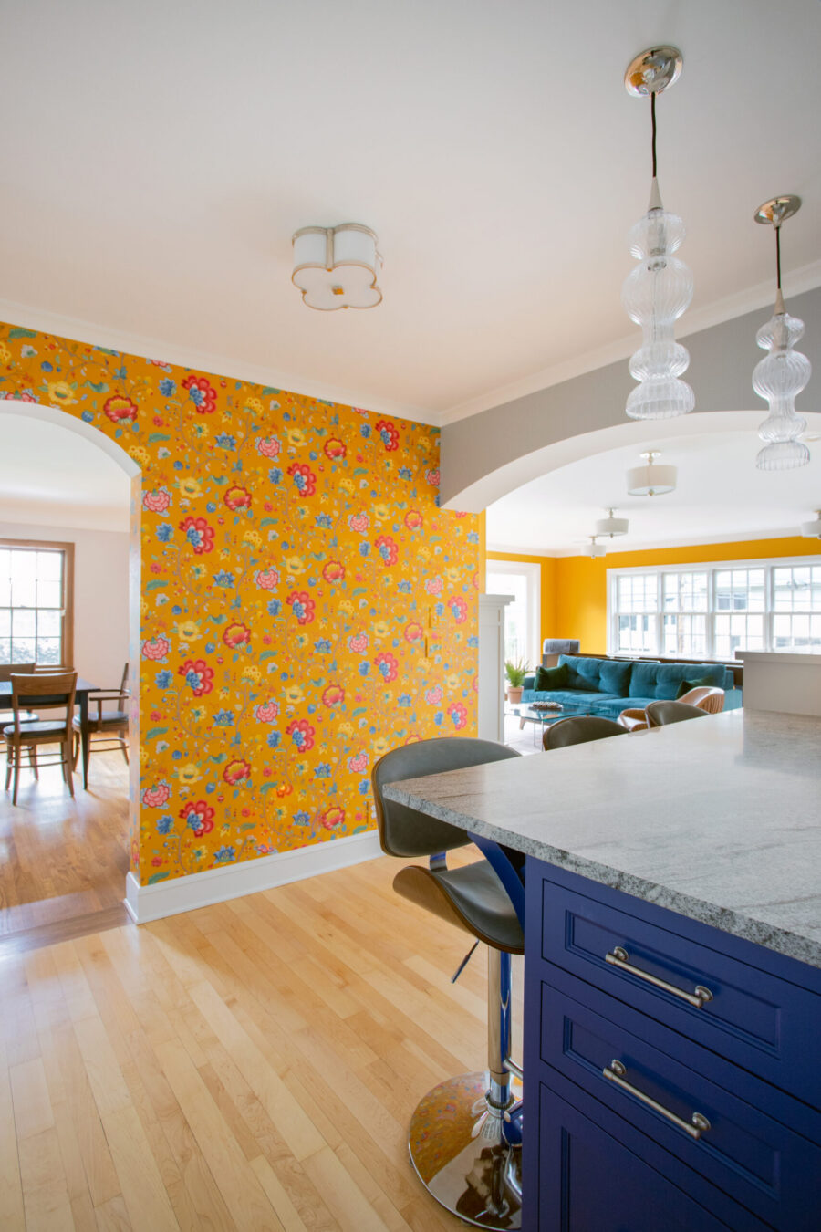 Twin Cities kitchen remodel. Blue island, granite, pendants, yellow floral wallpaper.