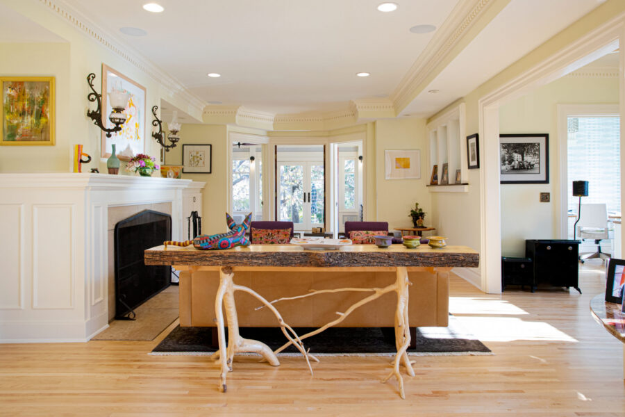 Bright Twin Cities interior boasts elaborate moldings, light hardwood, custom furniture design.