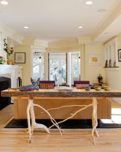 Bright Twin Cities interior boasts elaborate moldings, light hardwood, custom furniture design.