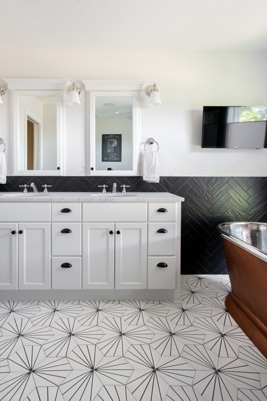 Twin Cities bathroom transformation features distinctive geometric floor, copper tub.