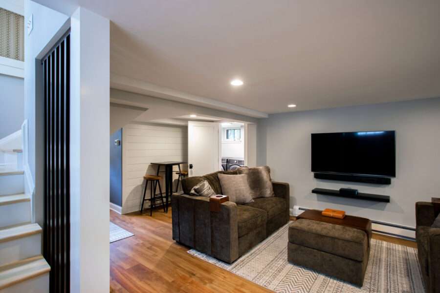 Twin Cities basement design-build integrates modern living and laundry.