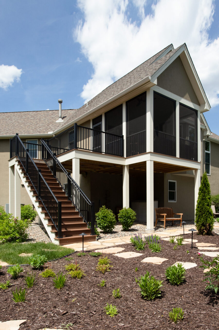 Exterior design-build created a multi-level deck, screened porch, illuminated landscaping.