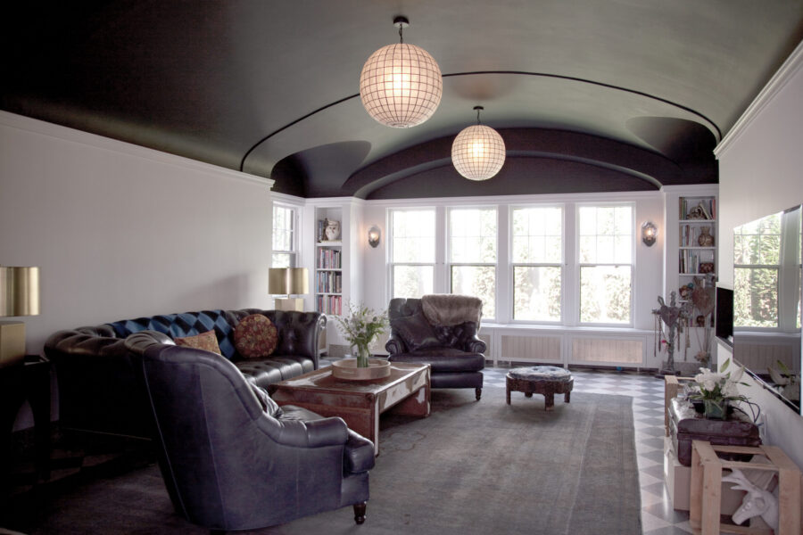 Luxurious Twin Cities interior remodeling features dark vaulted ceiling.