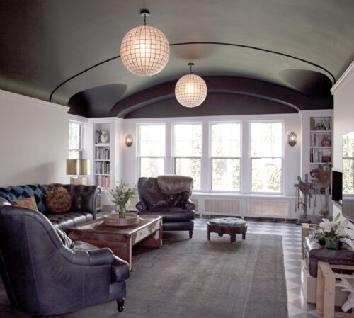 Luxurious Twin Cities interior remodeling features dark vaulted ceiling.