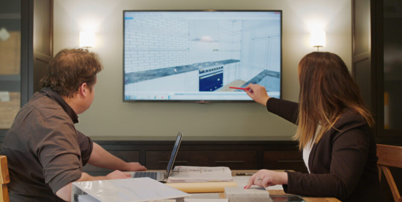 Design-build experts refine comprehensive Twin Cities kitchen remodel plans on-screen.