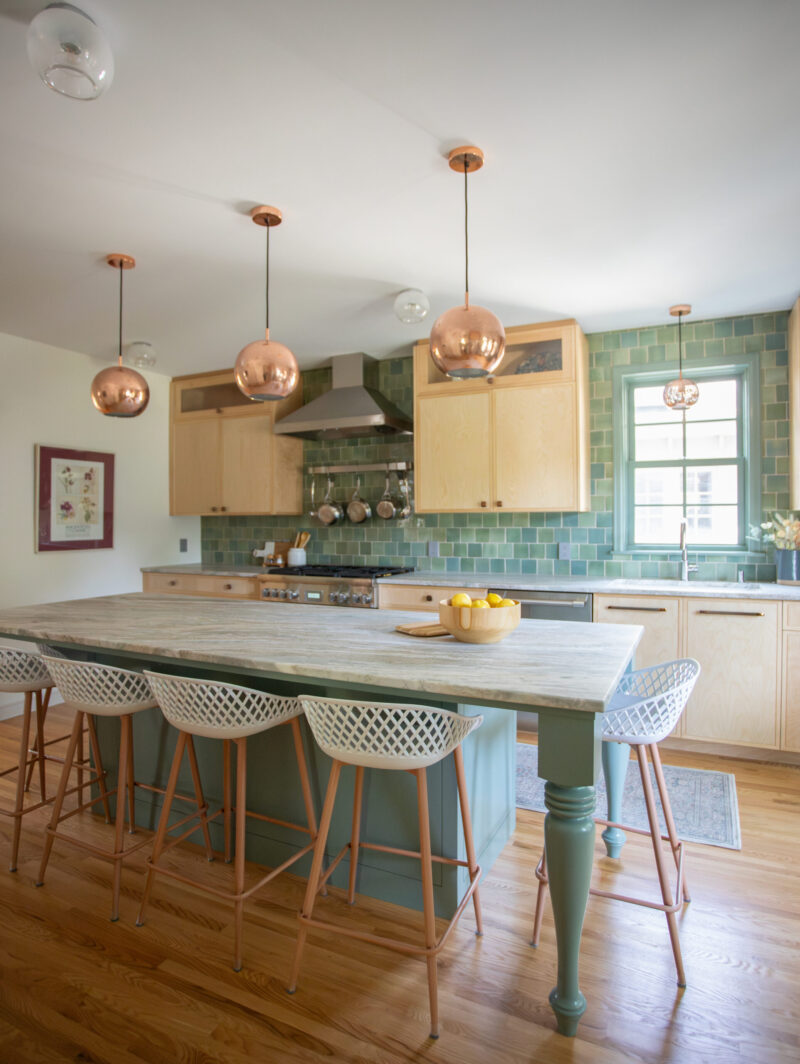 Twin Cities kitchen remodel: light wood, green tile, large island, copper lighting.