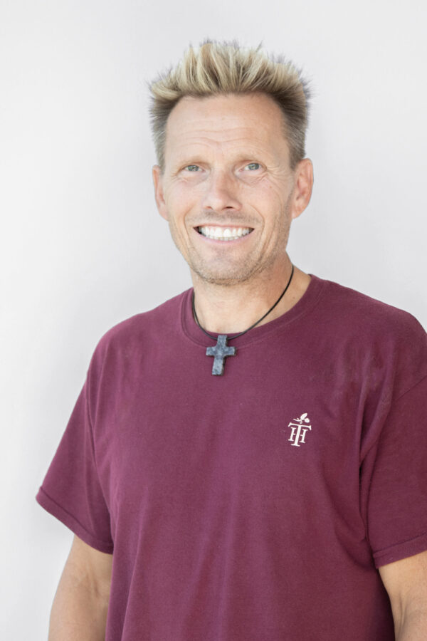 Bright, seamless white background material provides expansive, minimalist studio lighting.