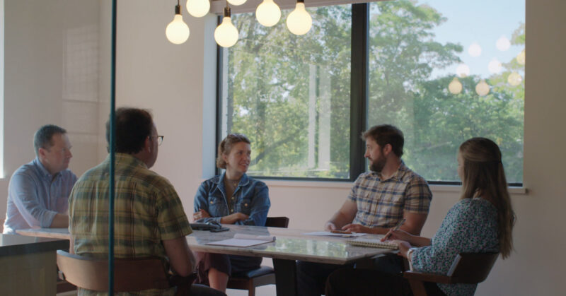 Five professionals collaboratively plan extensive design-build in modern Twin Cities interiors.