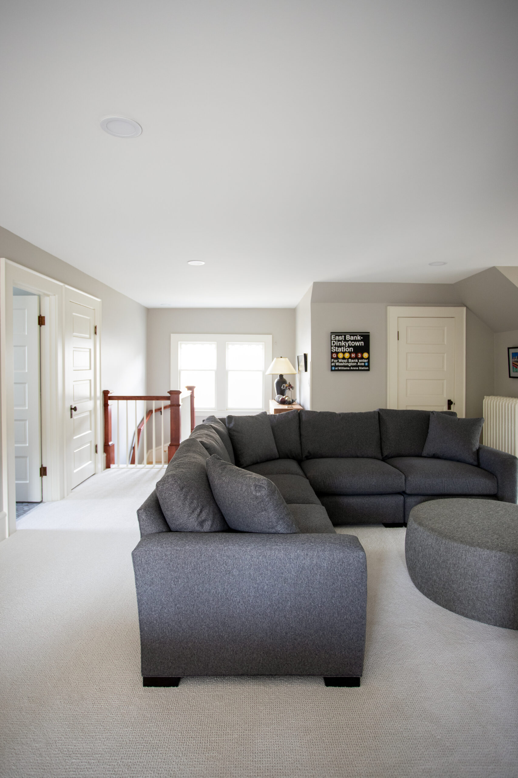 Open second floor family room with finely-detailed handcrafted architectural-millwork-stair-railing