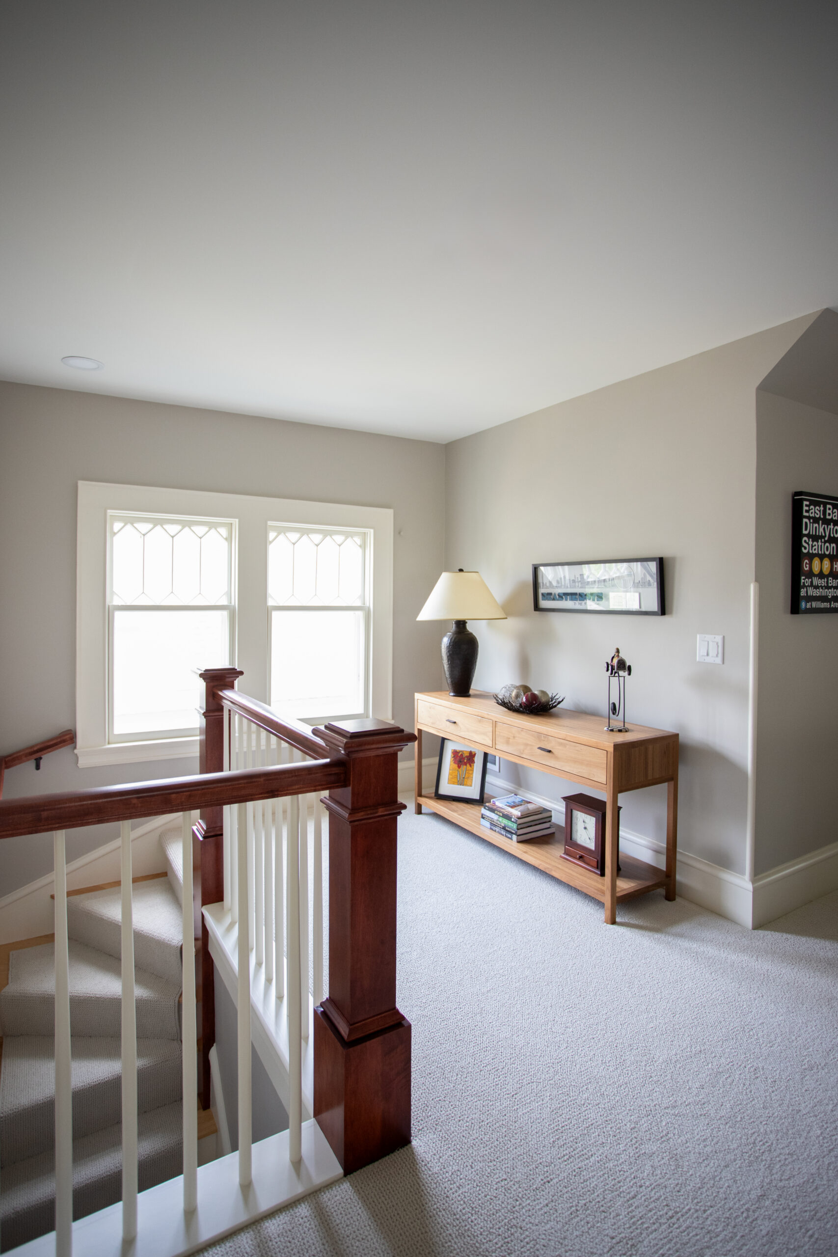 Second floor landing featuring architecturally significant stair railing craftsmanship