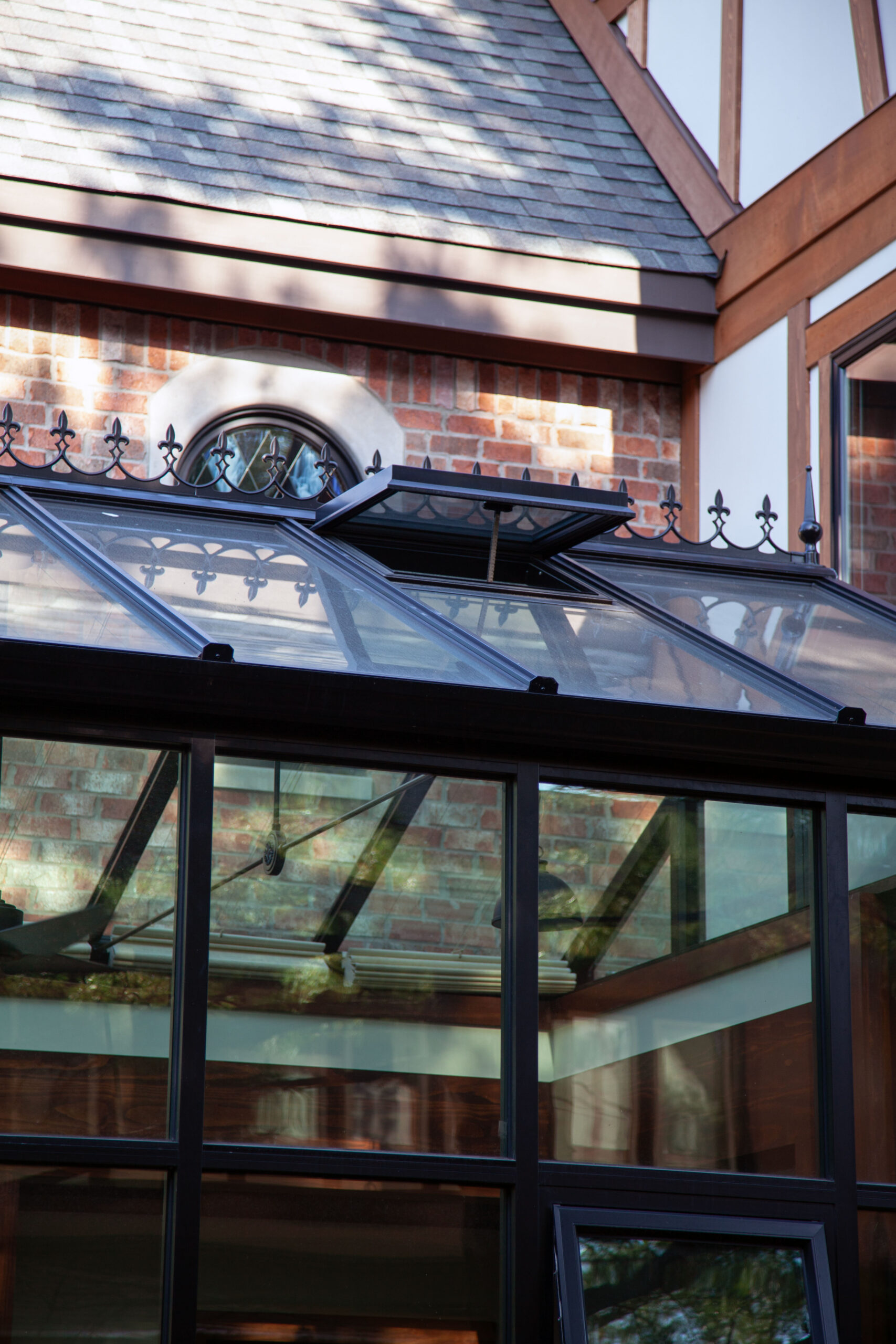 Year-round conservatory with motorized roof vents, automated blinds, and nine-foot sidewalls filled with natural light